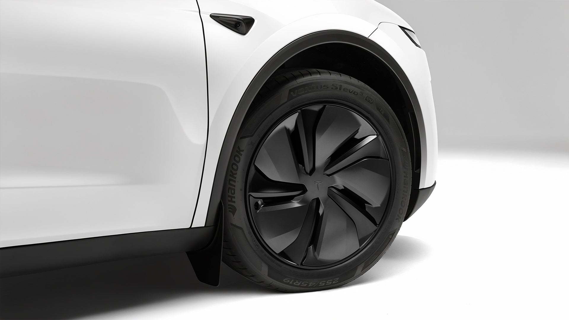 Before — bare alloy wheels without cover