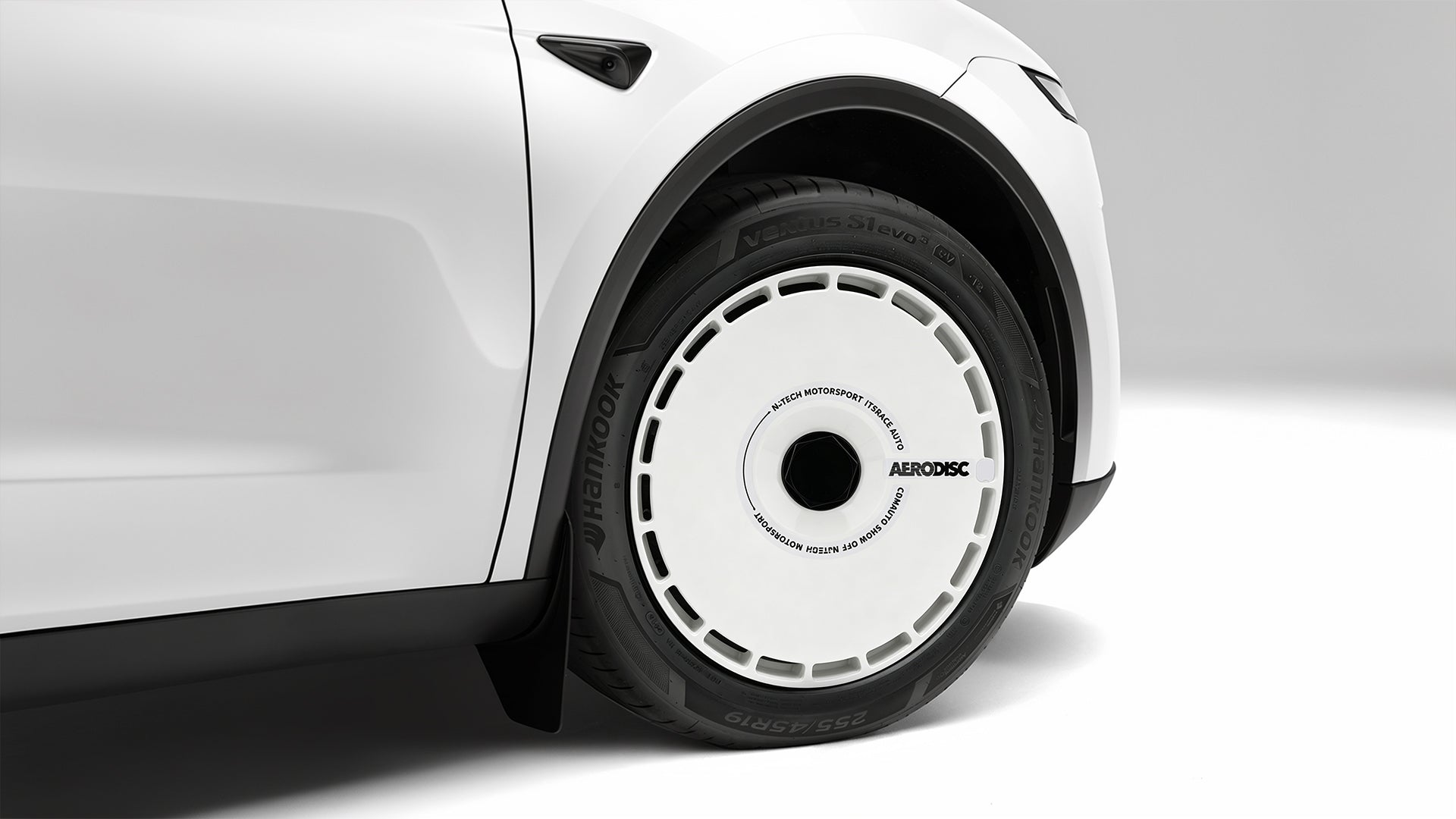 After — Tesla with Aero Disc wheel covers installed