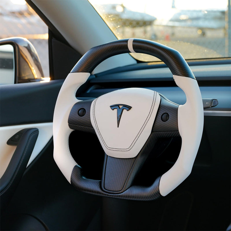 Style 42 square white and carbon fiber steering wheel installed in a compatible Tesla