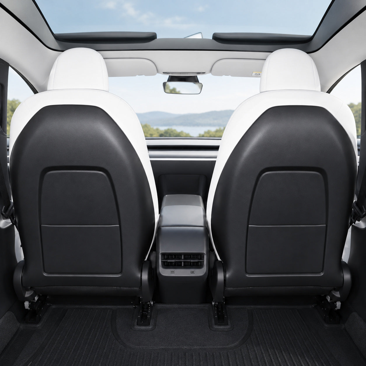 Factory black plastic front seat-back panels with storage pockets, in the same cabin view used for the after comparison. Appearance visualization.